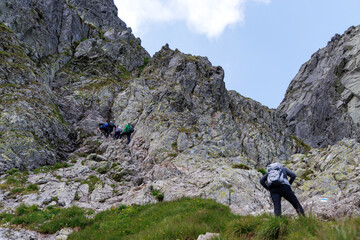 Hikers Approaching Steep Chain Section in High Tatra Mountains © Jorens