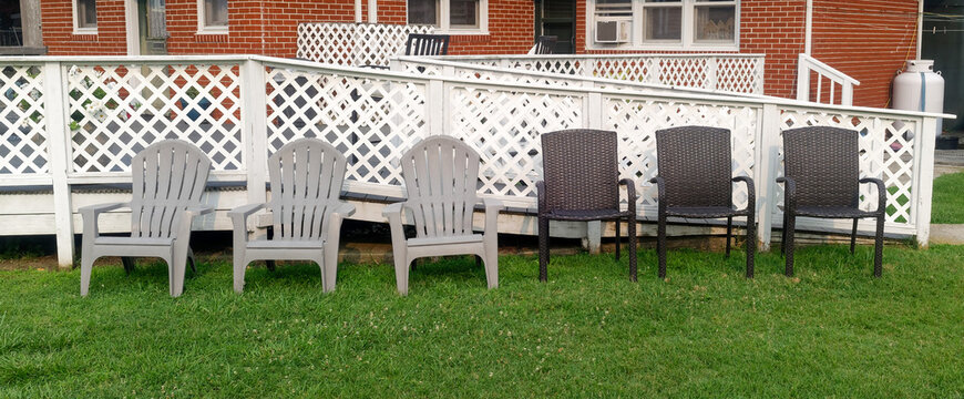 Empty chairs on grass