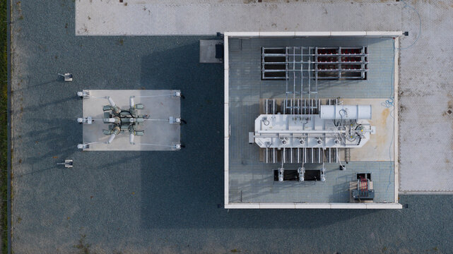 Aerial view of High Voltage Electrical Substation Surrounded by Farmland