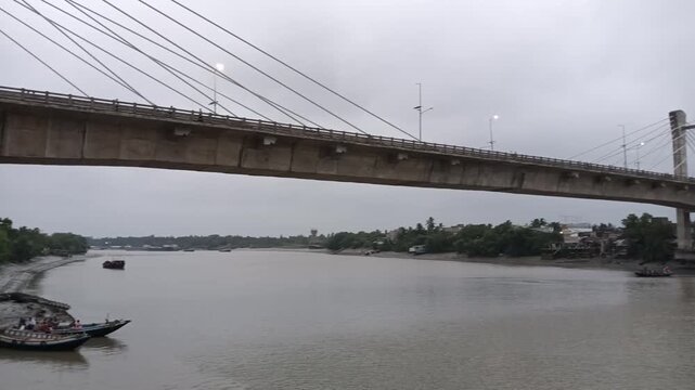 Modern Cable-Stayed Bridge Over a Wide River at Dusk
