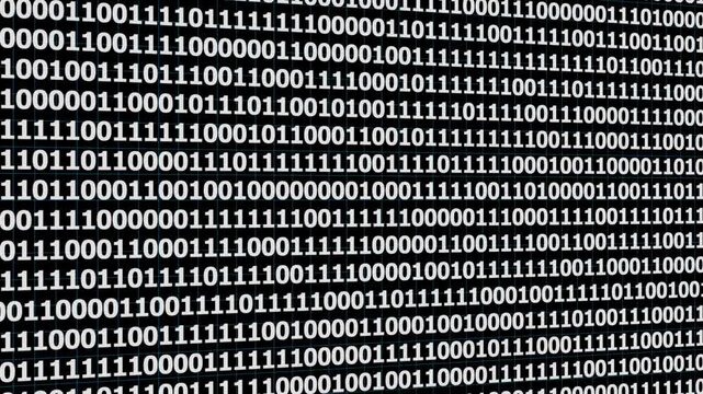 A video showcasing a green matrix of binary code on a computer screen
