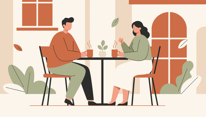 Fototapeta premium Man and woman enjoying a warm cup of coffee while sitting at an outdoor cafe table during a breezy autumn day.