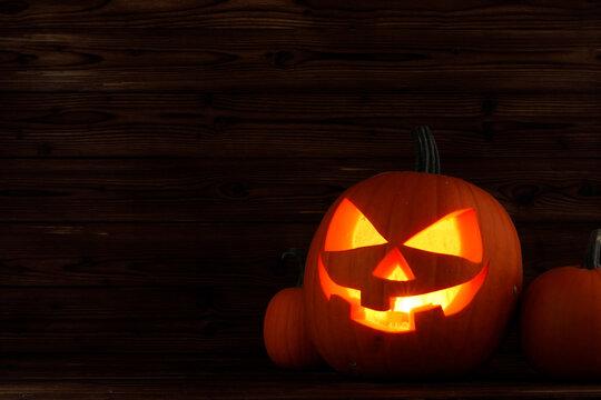 Halloween pumpkin lantern with burning candle inside