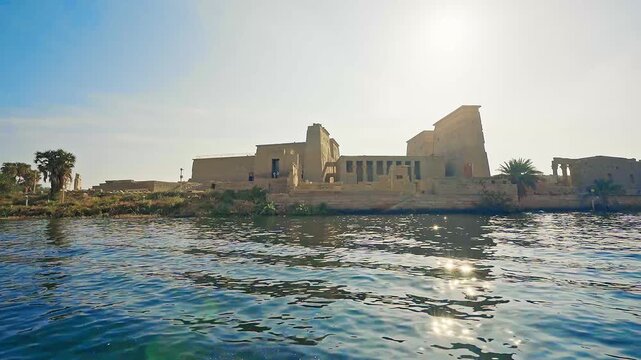 video from sailboat sailing on nile river of The ancient and historical Philae Temples complex in Aswan. it built to worship the goddess "Isis" - Egypt.