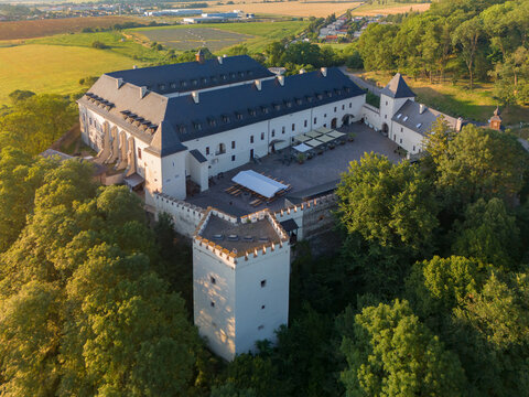 Aerial view of the historic Hotel Grand Viglas within the restored Viglas castle, featuring stone walls, a central courtyard, and surrounding trees in Viglas, Banskobystricky kraj, Slovakia.