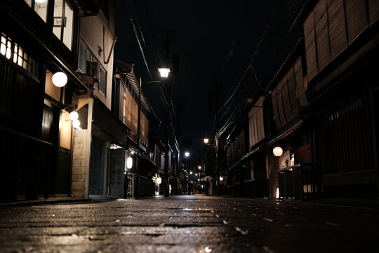 Traditional Japanese Street at Night with Lanterns and Wet Pavement Kyoto Japan gion