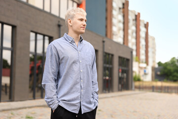 Fototapeta premium Handsome man in shirt outdoors. Space for text