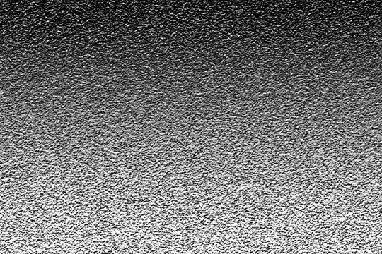 A black and white abstract background texture featuring a grainy digital noise pattern with a subtle vertical gradient transition from dark to light grey