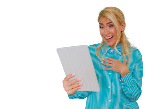 Happy woman experiencing excitement and surprise during a video call on a tablet, celebrating a win