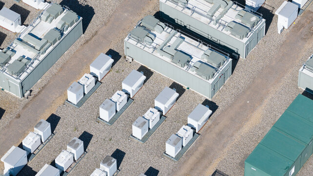 Aerial view of Pelham Storage Limited featuring rows of white storage units, gravel pathways, and green containers in Bishop's Stortford, England, United Kingdom.