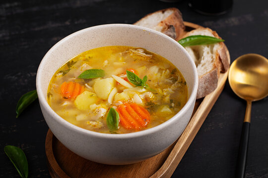 Comfort Food Chicken Orzo Soup Served with Artisan Bread