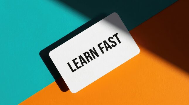White card with black text learn fast placed on a vibrant teal and orange background
