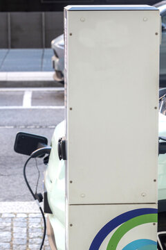 View of an electric vehicle charging station on a paved street in Porto, Porto, Portugal.