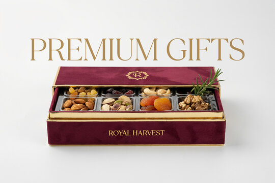 Elegant burgundy velvet gift box filled with an assortment of healthy nuts like pistachios almonds cashews walnuts and sweet dried fruits such as apricots and golden raisins a perfect gourmet present