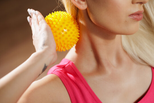 Self-Massage with a Yellow Massage Ball for Neck and Back Relief
