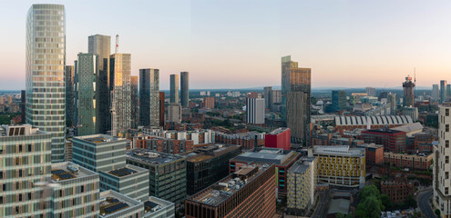 Fototapeta premium Panoramic View of Square Gardens and Acer Tower in Manchester Skyline at Dawn