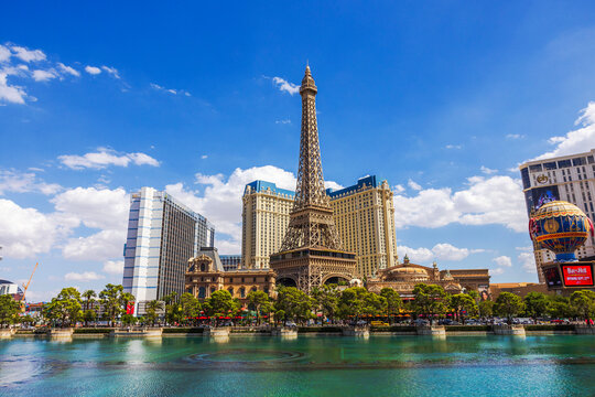 Beautiful view of Paris Las Vegas Eiffel Tower and hotel buildings across Bellagio lake. Las Vegas. USA. 