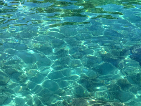 The crystal-clear turquoise water of the Mediterranean.
