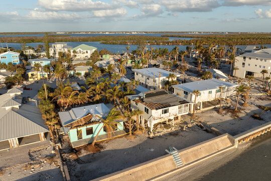 Destroyed houses on ocean shore after hurricane Milton landfall. Natural disaster consequences on Manasota Key, Florida. Storm surge severe damage