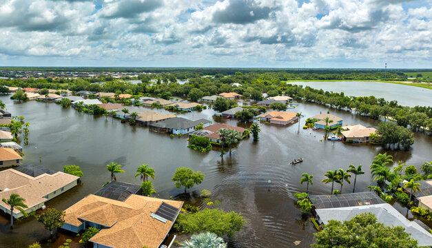 Flooded residential area with underwater houses from hurricane rainfall water in Florida suburban community. Aftermath of natural disaster in southern USA