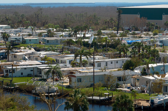 Strong hurricane winds severely damaged private houses in Florida mobile home residential area. Consequences of natural disaster