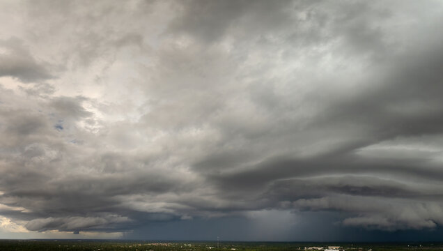 Tropical thunderstorm precipitation falling down on Florida town. Rain shower in summer