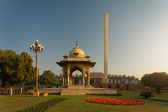 View of the Punjab Assembly building and the white marble pavilion set within a manicured garden in Lahore, Punjab, Pakistan.