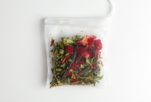 Herbal Tea Bag With Dried Rose Petals and Green Botanicals in White Mesh Sachet