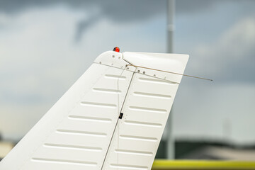 Small aircraft tail fin and rudder close up at airshow. © Trygve