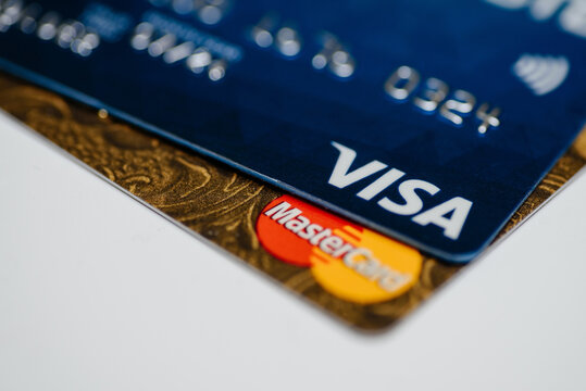 KIROV, RUSSIA - MAY 12, 2026 Visa logo, MasterCard logo, pile of multicolor bank cards, debit and credit cards, banking service concept, close-up view, selective focus