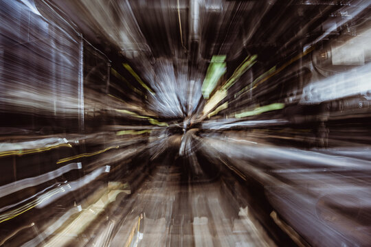 Blurry motion suggests high speed through an urban tunnel