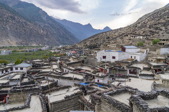 View of the traditional stone houses with flat roofs in the village of Marpha, nestled in the Himalayan mountains in Jomsom, Gandaki Province, Nepal.