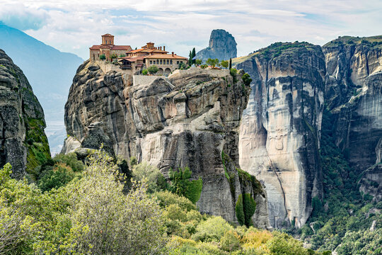 Meteora Monasteries Rising Among Giant Rock Formations in Greece.
Orthodox monastery landmarks perched on giant sandstone pillars, UNESCO Site.