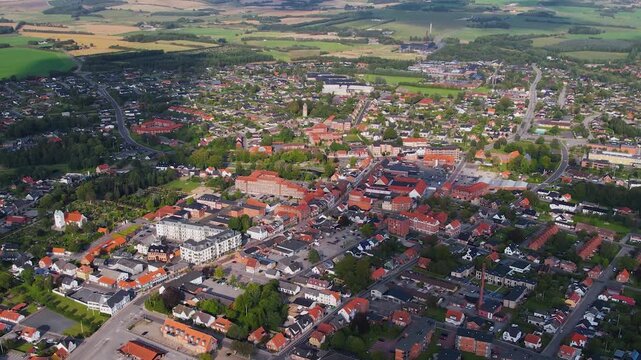 An aerial panorama beside the old town above the city Aars on a sunny summer afternoon in Denmark	