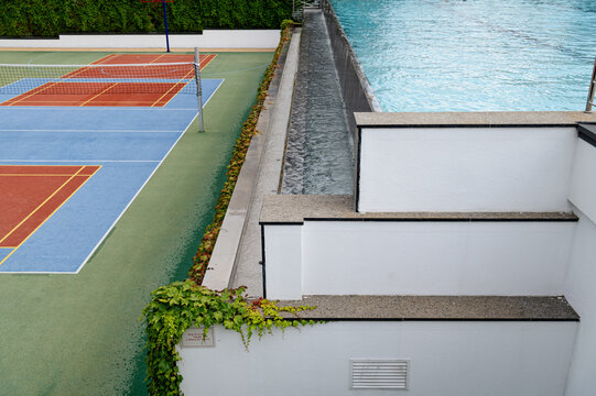 Tennis courts and water feature in a modern outdoor space