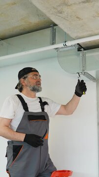 Professional hvac technician installing air duct ventilation system