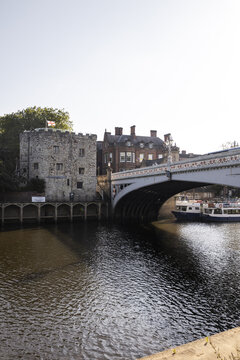 View of Lendal Bridge spanning the River Ouse with the historic Lendal Tower and traditional brick buildings in the background in York, England, United Kingdom.