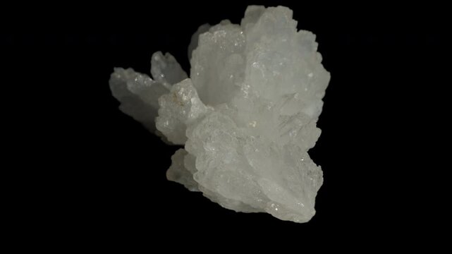 White celestine crystals isolated on a black background