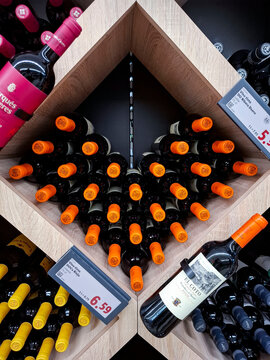 Calpe, Spain - May 27, 2026.Display of El Coto Spanish DOCa Rioja red wine in a wooden rack at a supermarket in Spain
