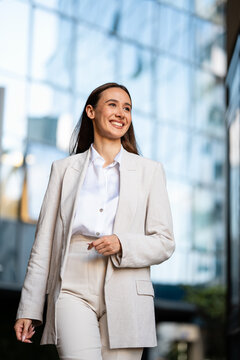 Young business woman smiling in modern city environment