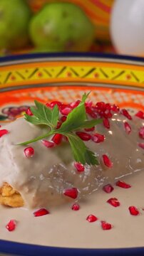 Close-up of Mexican Molletes topped with chorizo, cheese and salsa pico de gallo