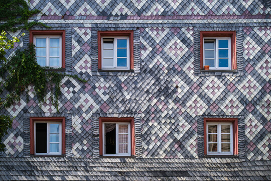 Furth, Bavaria, Germany - 15 July 2026: View of the historic facade in the old town of Furth, featuring intricate diamond-patterned slate tiles and traditional windows.
