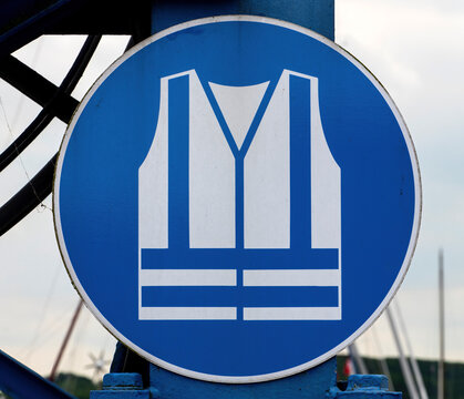 Mandatory Safety Vest Sign on Construction Site or Industrial Area