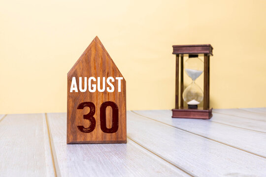 August 30 Date with Hourglass on Wooden Table Time Management and Deadline Concept