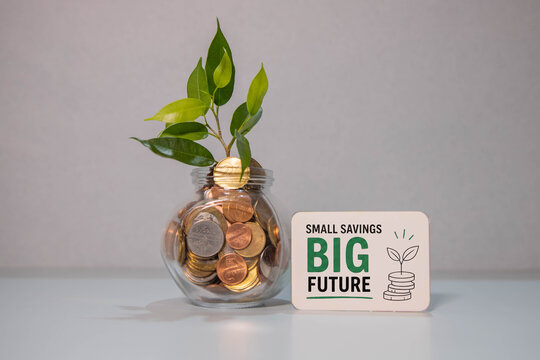 Small Savings Big Future &ndash; Money Jar with Growing Plant and Financial Growth Concept.