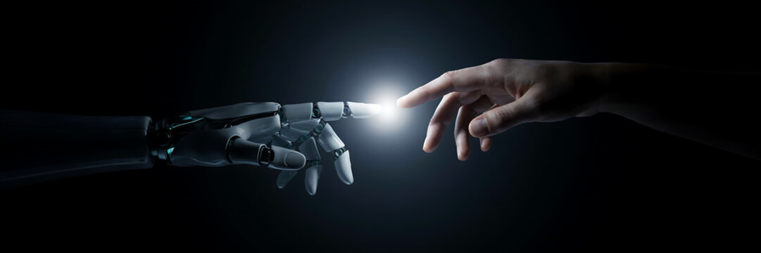 Robotic hand and human hand reaching towards each other with a bright glowing light point between fingers on a dark black background