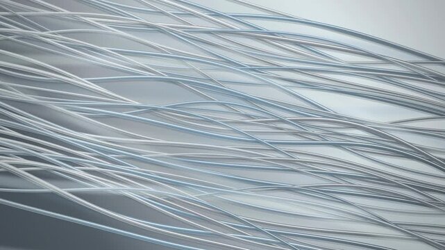 Numerous thin flexible white translucent tubes are densely arranged in an interwoven pattern