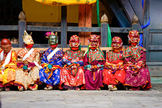 Bhutan, in the village of Bumthang, a monk mask dancer in his colourful costume at the festival of Jakar.