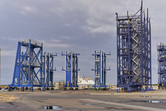 Esbjerg, Denmark - 26 July 2026: View of massive blue offshore sea-fastening frames with integrated stairs for wind turbine installation stored on the DSV logistics terminal.