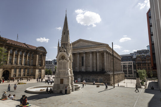 Birmingham, England, United Kingdom - 20 July 2026: View of the historic Chamberlain Memorial in Chamberlain Square, with the Birmingham Museum and Art Gallery in the background.